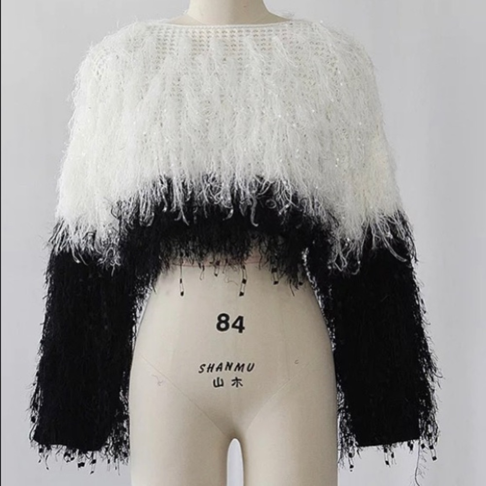 What’s and black sweater